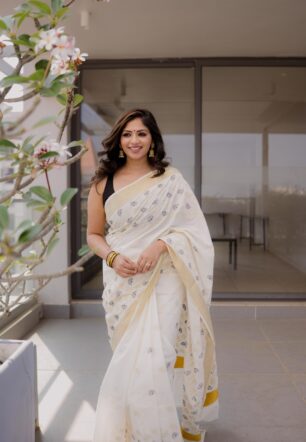 Myil Ezha :  gold and black cotton embroidered saree